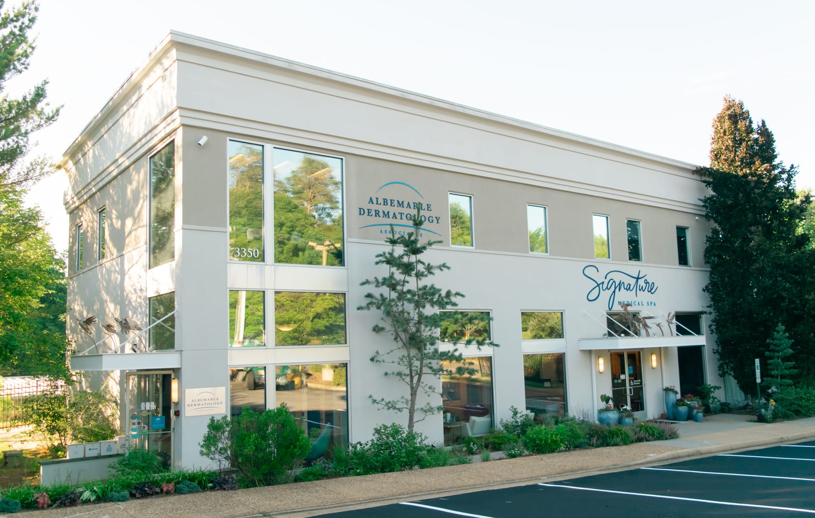 The practice building at 3350 Berkmar Drive, signed Albemarle Dermatology Associates and Signature Medical Spa, above its parking lot
